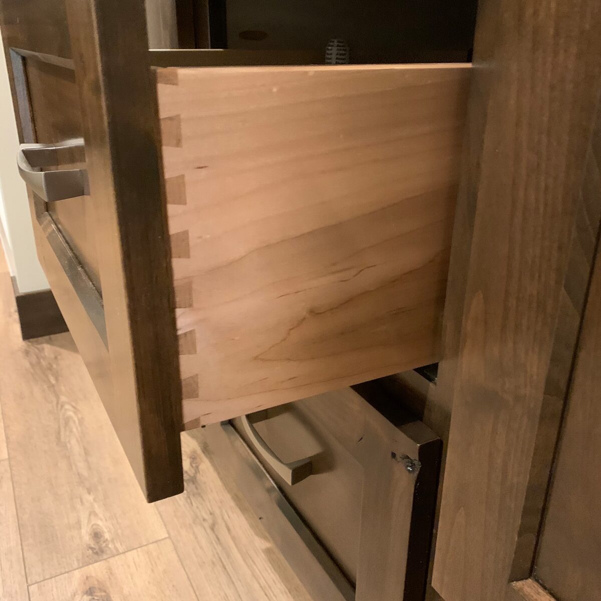 Open drawer showing dovetail joinery